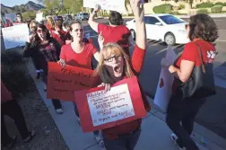  ??  ?? Teachers and their supporters protest Monday outside the KTAR-FM (92.3) studios, where Gov. Doug Ducey was being interviewe­d.