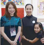  ??  ?? AFP co-founder Dindin Araneta is flanked by daughter Lucia and Michelle Perez.