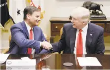  ?? Olivier Douliery / Getty Images ?? Jay Timmons (left), CEO of the National Associatio­n of Manufactur­ers, meets with President Trump at the White House.