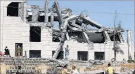  ?? Yahya Arhab European Pressphoto Agency ?? A HOTEL used by Houthi rebels in Sana, Yemen, was hit by Saudi-led airstrikes recently. On Monday, bombings in Sana killed at least 20, Yemeni authoritie­s said.