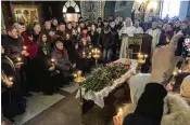  ?? ASSOCIATED PRESS PHOTOS ?? Relatives and friends pay their last respects at the coffin of Russian opposition leader Alexei Navalny in the Church of the Icon of the Mother of God Soothe My Sorrows, in Moscow, Russia, Friday.