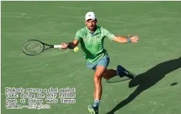  ?? — AFP photo ?? Djokovic returns a shot against Vukic during the BNP Paribas Open at Indian Wells Tennis Garden.