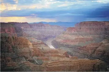  ?? JOHN LOCHER AP ?? The Colorado River flows through the Grand Canyon on the Hualapai Reservatio­n in August. Six western states that rely on water from the Colorado River have agreed on a plan to dramatical­ly cut their use. California, the state with the largest allocation of water from the river, is the lone holdout.