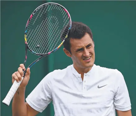  ??  ?? CONTROVERS­Y: Australia’s Bernard Tomic reacts after his first round Wimbledon loss to Germany's Mischa Zverev.