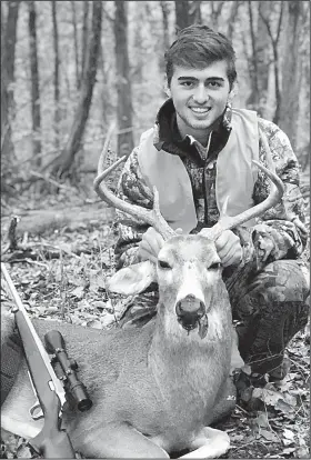  ?? Photo submitted by Brad Kohler ?? Guilherme Ribeiro, 17, an exchange student from Itajai, Brazil, was initiated into Arkansas’ hunting culture Nov. 11 when he killed this buck while hunting with his exchange host, Brad Kohler.