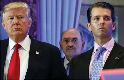  ?? Photograph: Evan Vucci/AP ?? Former Trump Organizati­on CFO Allen Weisselber­g flanked by Donald Trump and his son Donald Trump Jr in 2017.