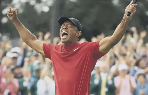  ??  ?? 0 Tiger Woods roars with joy after ending an 11-year drought in majors as he won The Masters for a fifth time at Augusta last month.
