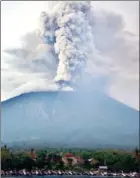  ?? SONNY TUMBELAKA/AFP ?? A view of Mount Agung spewing smoke yesterday.
