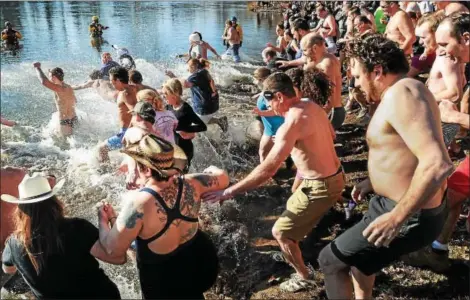  ?? DIGITAL FIRST MEDIA FILE PHOTO ?? Hearty area residents take a dip into the Schuylkill River on New Year’s Day in 2015 as part of the annual Polar Plunge held at Riverfront Park in Pottstown.