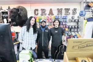  ?? Pictures: Robert Melen ?? Manager Lee Jones with Dan Morris and Chris Capel at Cranes Music in Swansea.