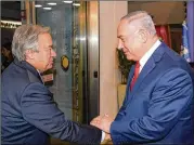  ?? AMOS BEN GERSHOM / GPO / GETTY IMAGES ?? Israeli Prime Minister Benjamin Netanyahu (right) shakes hands Monday with U.N. Secretary-General Antonio Guterres in Jerusalem. Guterres is on a four-day visit to Israel.