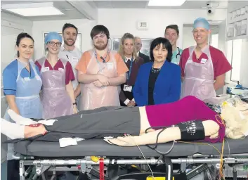  ??  ?? Launch Cabinet Secretary Jeane Freeman (third right) with NHS staff in the MSU