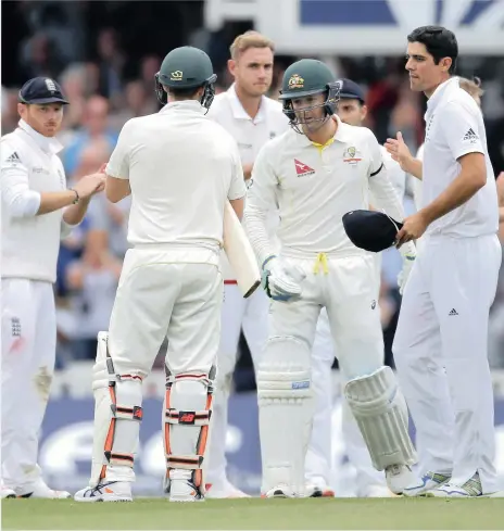  ?? PICTURE: REUTERS ?? ON HIS WAY OUT: England captain Alastair Cook shakes the hand of his Australia counterpar­t Michael Clarke as he came out to bat in his last Test match yesterday. The retiring Clarke scored 15 on the first day of the final Ashes Test at The Oval. David...