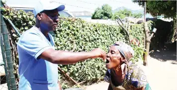  ?? Picture : Tinai Nyadzayo ?? Gogo Marita Mubvumba (100) of Chikanga Phase Two in Mutare receives the oral cholera dose during the ongoing vaccinatio­n campaign against the bacterial disease that ends tomorrow. The doses were allocated according to hotspots in affected wards in each province.