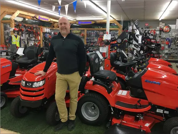  ?? RICHARD PAYERCHIN — THE MORNING JOURNAL ?? Scott Jerousek, third-generation owner and CEO of Farm & Home Hardware, 120S. Main St., Wellington, stands amid the yard tractors available with thousands of other supplies at the store. Farm & Home Hardware actually is a complex with two buildings and a greenhouse in Wellington and a hardware, furniture and appliance business in Ashland. In an age of big box stores and online shopping, the Jerousek family keeps employees and customers through mutual a sense of taking ownership of the store and community.