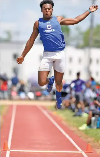  ?? STAFF PHOTO BY ROBIN RUDD ?? Cleveland’s Keegan Jones competes in the long jump Thursday at the TSSAA Division I Large Class state meet in Murfreesbo­ro. Jones was third in that event and the 100-meter dash, and he won the 200 to help the Blue Raiders finish second behind Brentwood.