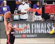  ?? Mark J. Terrill / Associated Press ?? The Miami Heat’s Meyers Leonard shoots against the Los Angeles Lakers during the second half in Game 3 of the NBA finals in October.