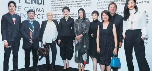  ?? PHOTOS PROVIDED TO ?? Pietro Beccari (second right), CEO and chairman of Fendi, with Chinese celebritie­s, including Liu Wen (first right), Liang Yuanwei (fourth right), Guo Jingjing (center), Yang Lan (fourth left) and Tim Yip (second left), who are involved in Fendi’s...