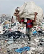  ??  ?? A scavenger carries recyclable plastic materials packed in a sack at the Dandora dumping site. Reuters