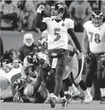  ?? Hyoung Chang, Denver Post file ?? Baltimore Ravens quarterbac­k Joe Flacco celebrates the touchdown that tied the 2013 AFC divisional playoff game in Denver. The Ravens won 38-35 in double overtime.