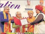  ?? PTI ?? Vice-President Jagdeep Dhankhar with Haryana CM Manohar Lal Khattar confers a degree upon a student during the 3rd convocatio­n of Baba Mastnath University in Rohtak on Tuesday.