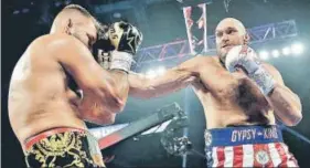  ?? AP ?? ■ Tyson Fury lands a punch on Tom Schwarz of Germany during a heavyweigh­t boxing match at MGM Grand Garden Arena in Las Vegas on Saturday