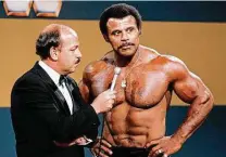  ?? WWE / Associated Press ?? “Mean” Gene Okerlund interviews Rocky “Soulman” Johnson. Johnson was a WWE Hall of Fame wrestler and father of actor Dwayne “The Rock” Johnson. The elder Johnson has died at 75.
