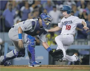  ?? Mark J. Terrill Associated Press ?? DODGERS STARTER Kenta Maeda zeroes in on the plate and scores a run during the fourth inning Friday night. Maeda singled off of Royals pitcher Jason Hammel and scored on a single by Corey Seager.