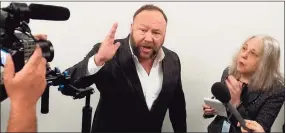  ?? Saul Loeb / AFP / Getty Images ?? Extremist Alex Jones speaks outside a hearing room prior to a House Judiciary Committee hearing on Capitol Hill in Washington, D.C., on Dec. 11, 2018.