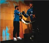  ?? Bay Area News Group ?? San Francisco 49ers quarterbac­k Jimmy Garoppolo high-fives the San Jose Sharks’ Joe Pavelski before for Game 3 of their playoff series against the Vegas Golden Knights on Monday night in San Jose. Game 4 is tonight with Vegas leading 2-1.