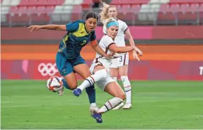  ?? GEOFF BURKE/USA TODAY SPORTS ?? Australia’s Sam Kerr, left, and the USA’s Julie Ertz battle for the ball during the 0-0 tie Tuesday.