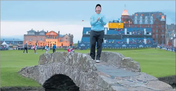  ??  ?? TWILIGHT ZONE: Watson stops to pose on the iconic Swilcan Bridge on the 18th hole of the Old Course at St Andrews in his final Open Championsh­ip.