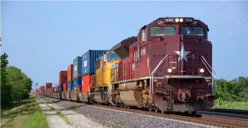  ??  ?? Union Pacific’s Katy heritage unit leads a train pulling out of the Global IV intermodal terminal in Joliet, Ill., and heading south onto the Chicago-St. Louis main line on Aug. 11, 2021. A week-long embargo on traffic from the West Coast helped Global IV address its congestion.