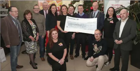  ??  ?? The Committee and supporters of the Laugh out Louth festival pictured with the final cheque which was presented to the Samaritans.