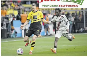  ?? (Photos: AFP) ?? Dortmund’s German defender (left) Nico Schlotterb­eck and Bayer Leverkusen’s Dutch defender Jeremie Frimpong vie for the ball during the German first division Bundesliga football match between Borussia Dortmund and Bayer Leverkusen in Dortmund, western Germany, on April 21, 2024.