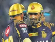  ?? AFP ?? KKR’s Robin Uthappa (R) says Gautam Gambhir and Dinesh Karthik are different but both have a winning mentality.