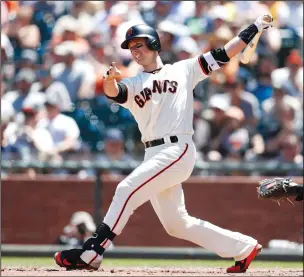  ?? NHAT V. MEYER/TRIBUNE NEWS SERVICE ?? The San Francisco Giants' Buster Posey hits a double against the San Diego Padres in San Francisco on June 24, 2018.