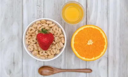  ?? ?? Never the twain shall meet … cereal and orange juice. Photograph: Phamai Techaphan/Getty Images