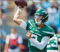  ?? Nell Redmond / Associated Press ?? New York Jets quarterbac­k Zach Wilson throws a pass against the Carolina Panthers in the first half last Sunday.