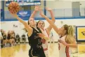  ?? MIKE MANTUCCA/DAILY SOUTHTOWN ?? Sandburg’s Lauren Coghlan goes for a layup against Lincoln-Way Central’s Angelina Panos, center, and Keira Hunt.