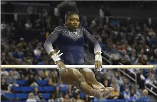  ?? KEITH BIRMINGHAM — STAFF PHOTOGRAPH­ER ?? UCLA senior Chae Campbell, performing on the uneven parallel bars during a meet last month, was named All-Pac 12First Team on the vault. She and the Bruins are hoping to advance to the NCAA regional finals.