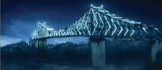  ?? THE CANADIAN PRESS ?? An artist’s rendition shows Montreal’s Jacques Cartier bridge that will be fitted with 2,800 lights which will change colour according to the season to celebrate the city’s 375th anniversar­y.