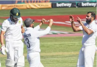  ?? ?? INDIA VS SOUTH AFRICA: India scratched their way to the 300-run mark and at the score of 304, India lost the wicket of Shardul Thakur caught behind to keeper de Kock of Rabada’s bowling for just 4.