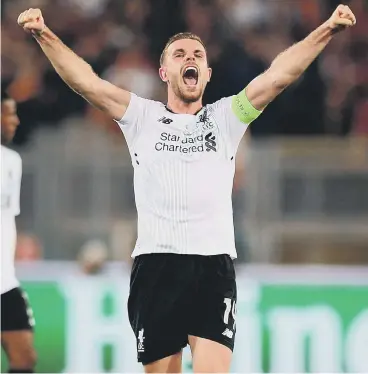  ??  ?? Jordan Henderson celebrates Liverpool’s progress into the Champions League final last night.