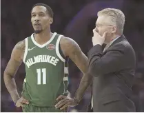  ?? AP PHOTO ?? CONFIDENCE BUILDER: Brandon Jennings looks on with Bucks coach Joe Prunty during a game last week.