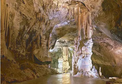  ?? Photo by SONIA BANTA ?? Inside Postojna Cave are stunning stalactite­s and stalagmite­s.