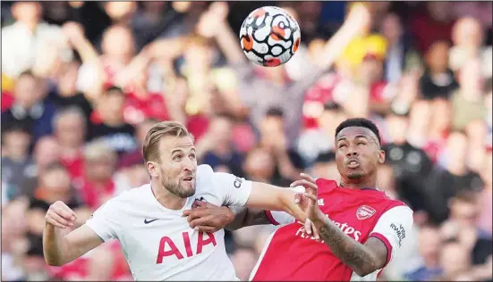  ?? ?? Tottenham’s Harry Kane,( left), jumps for a header with Arsenal’s Gabriel during the English Premier League soccer match between Arsenal and Tottenham Hotspur at the Emirates Stadium in London. (AP)