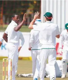  ?? AFP ?? South African pacer Kagiso Rabada (left) celebrates the wicket of Bangladesh’s Mushfiqur Rahim during the fifth day of the first Test in Potchefstr­oom yesterday.