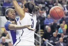  ?? CHARLES KRUPA/ASSOCIATED PRESS ?? Kentucky center DeNesha Stallworth (left) dumps off the ball as she is pressured by Connecticu­t forward Morgan Tuck in the first half Monday in Bridgeport, Conn. UConn won and advanced to its sixth straight Final Four.