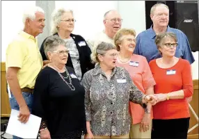  ?? Photo by Mike Eckels ?? A group of Decatur High alumni takes a picture during the 2016 Decatur Alumni Associatio­n biennial banquet April 23 in the community room at city hall in Decatur.